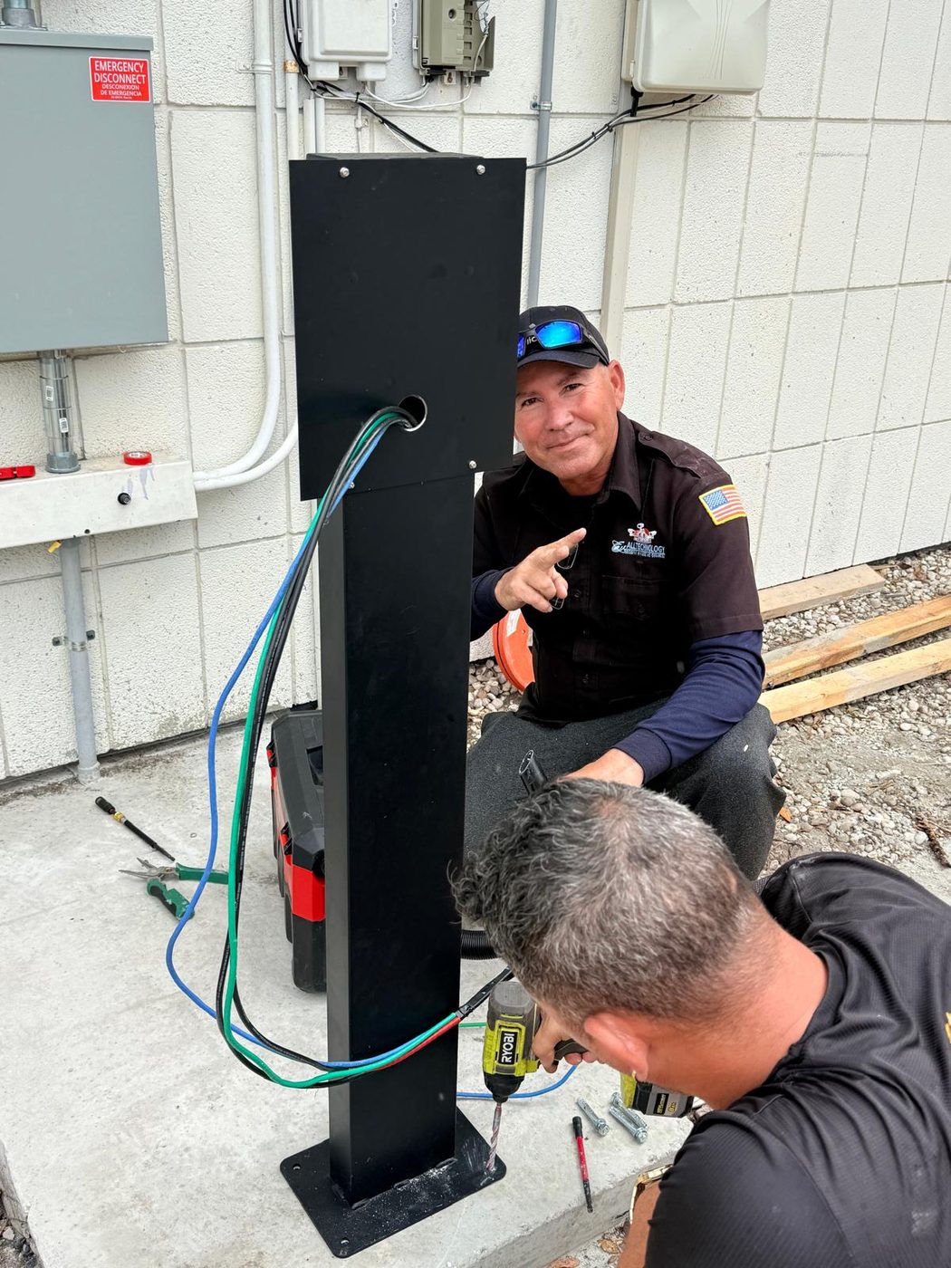 All Technology Security team installing commercial EV charger in Sarasota FL