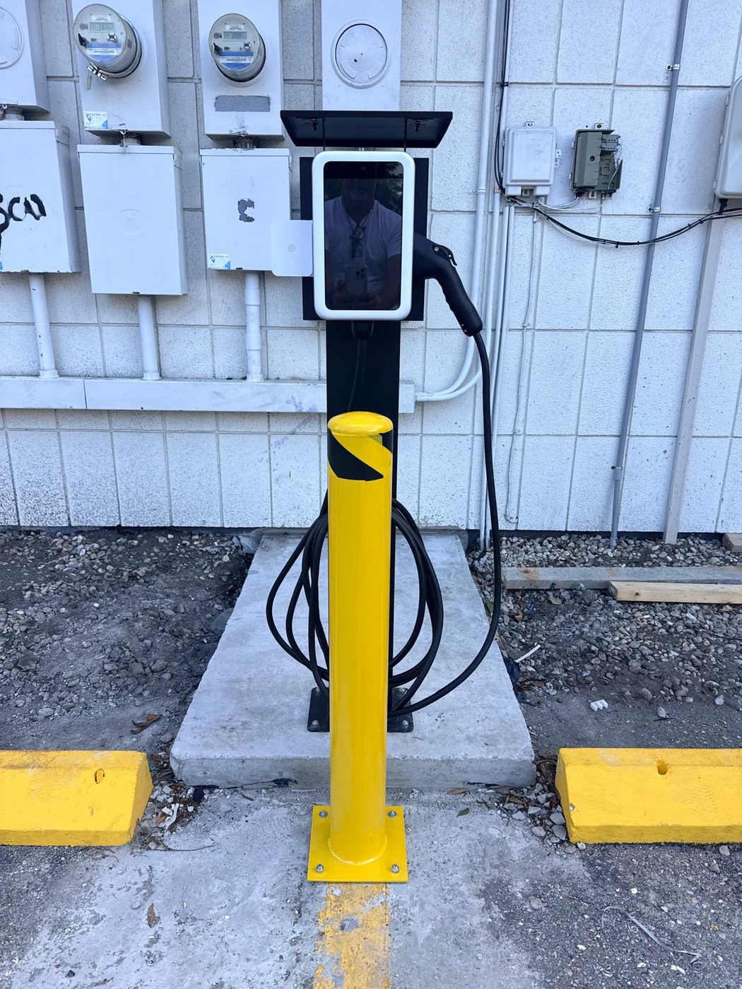 Commercial EV charging station installation at a Sarasota FL parking facility — All Technology Security serving Siesta Key